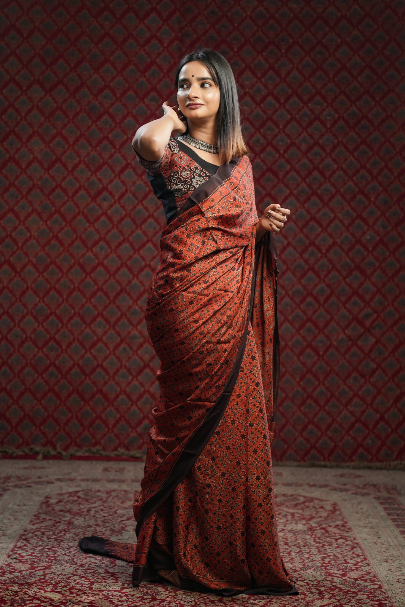 Red base Ajrakh Printed Modal Silk Saree with Blue & Brown Floral Print