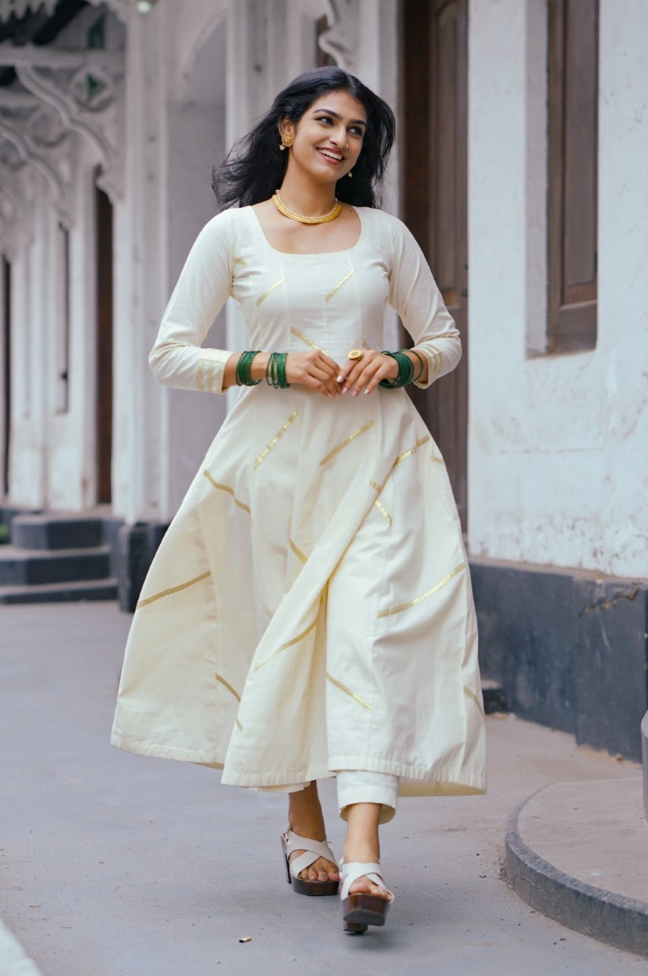 Off White Panel Anarkali with Asymmetrical Zig Zag Kasavu Off White Panel Anarkali with Asymmetrical Zig Zag Kasavu