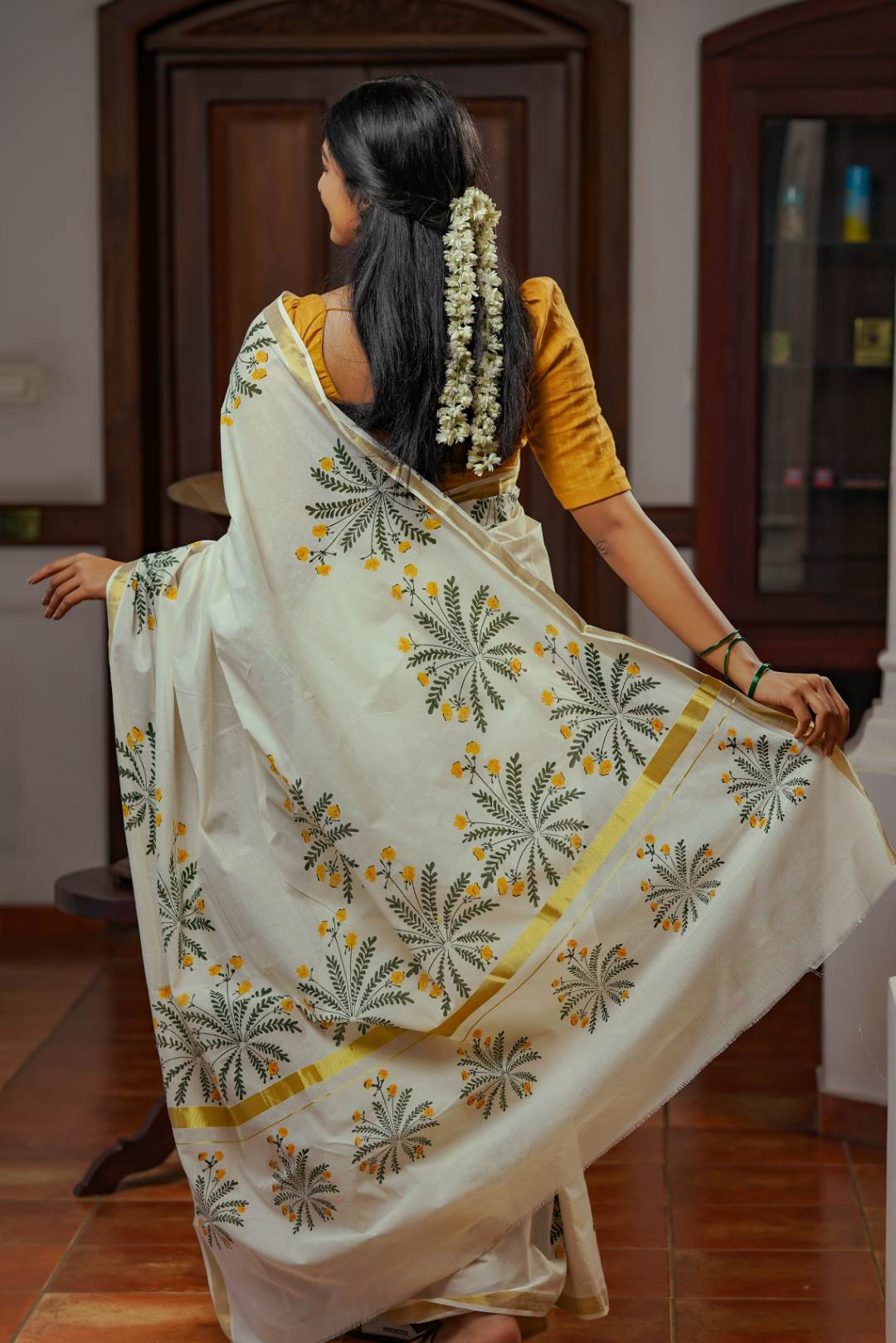 Offwhite Golden Kasavu Saree with Mukutti Floral Handblock Print