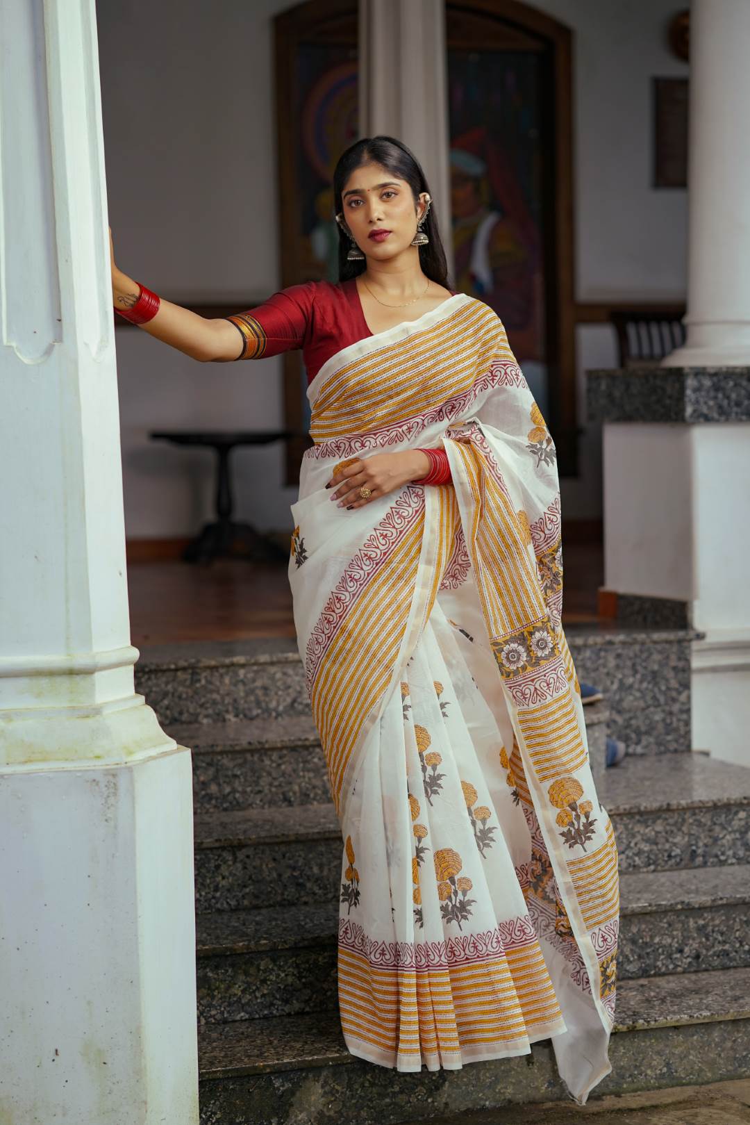 Offwhite Chanderisilk Saree with Marrie Gold Floral Motif