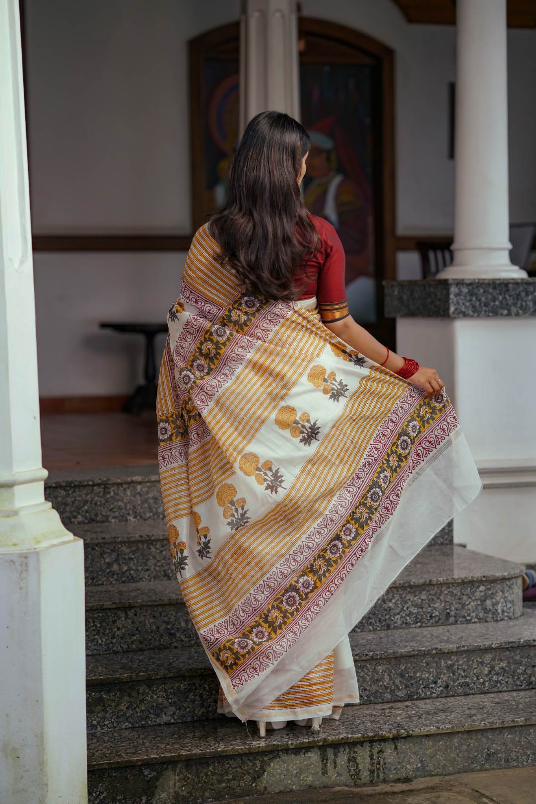 Offwhite Chanderisilk Saree with Marrie Gold Floral Motif