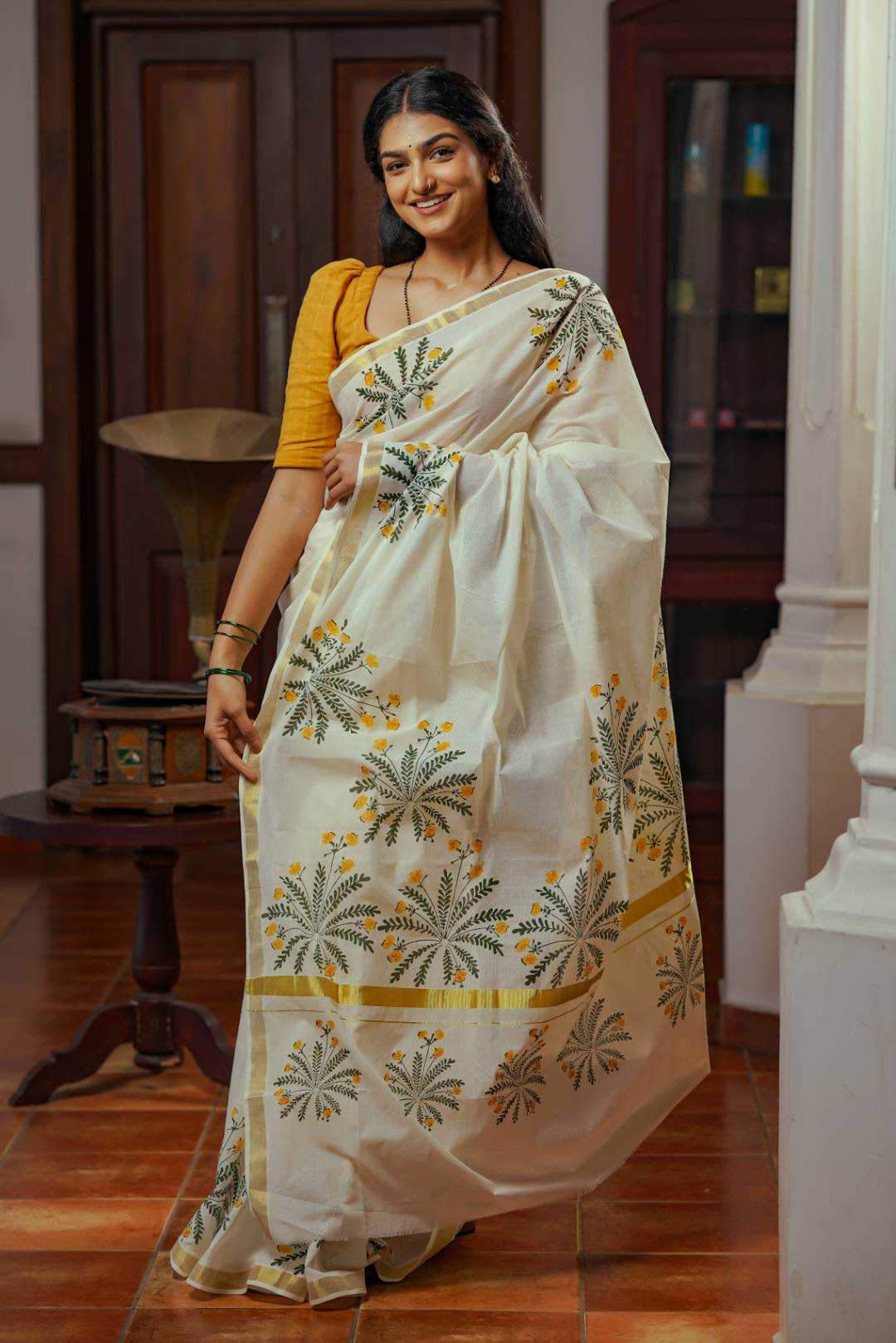 Offwhite Golden Kasavu Saree with Mukutti Floral Handblock Print