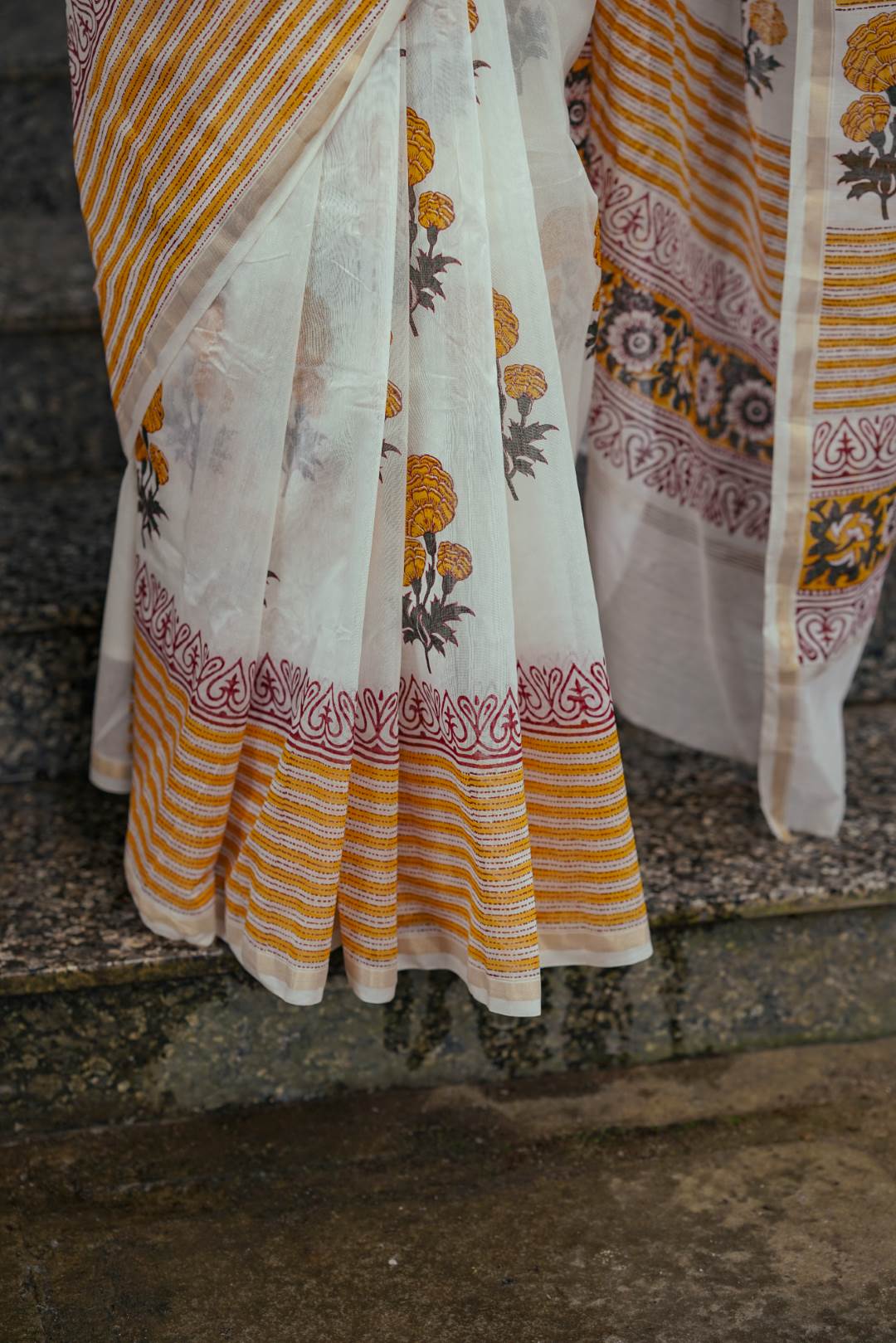 Offwhite Chanderisilk Saree with Marrie Gold Floral Motif
