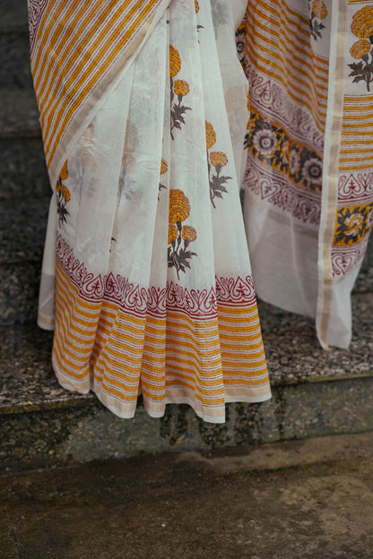 Offwhite Chanderisilk Saree with Marrie Gold Floral Motif