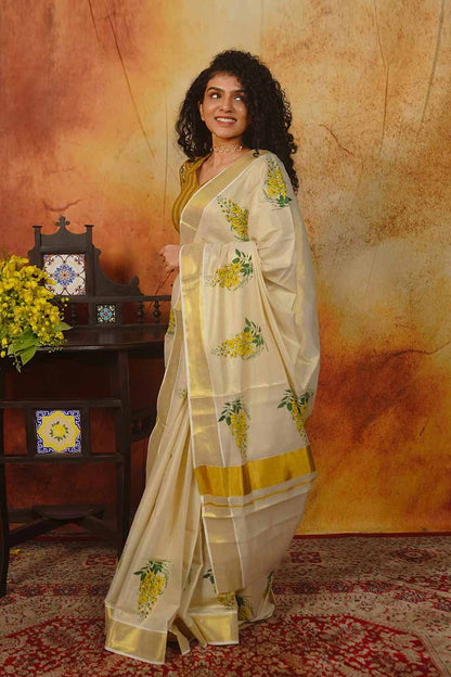 Kerala Golden Tissue Saree with Golden Shower Floral Print