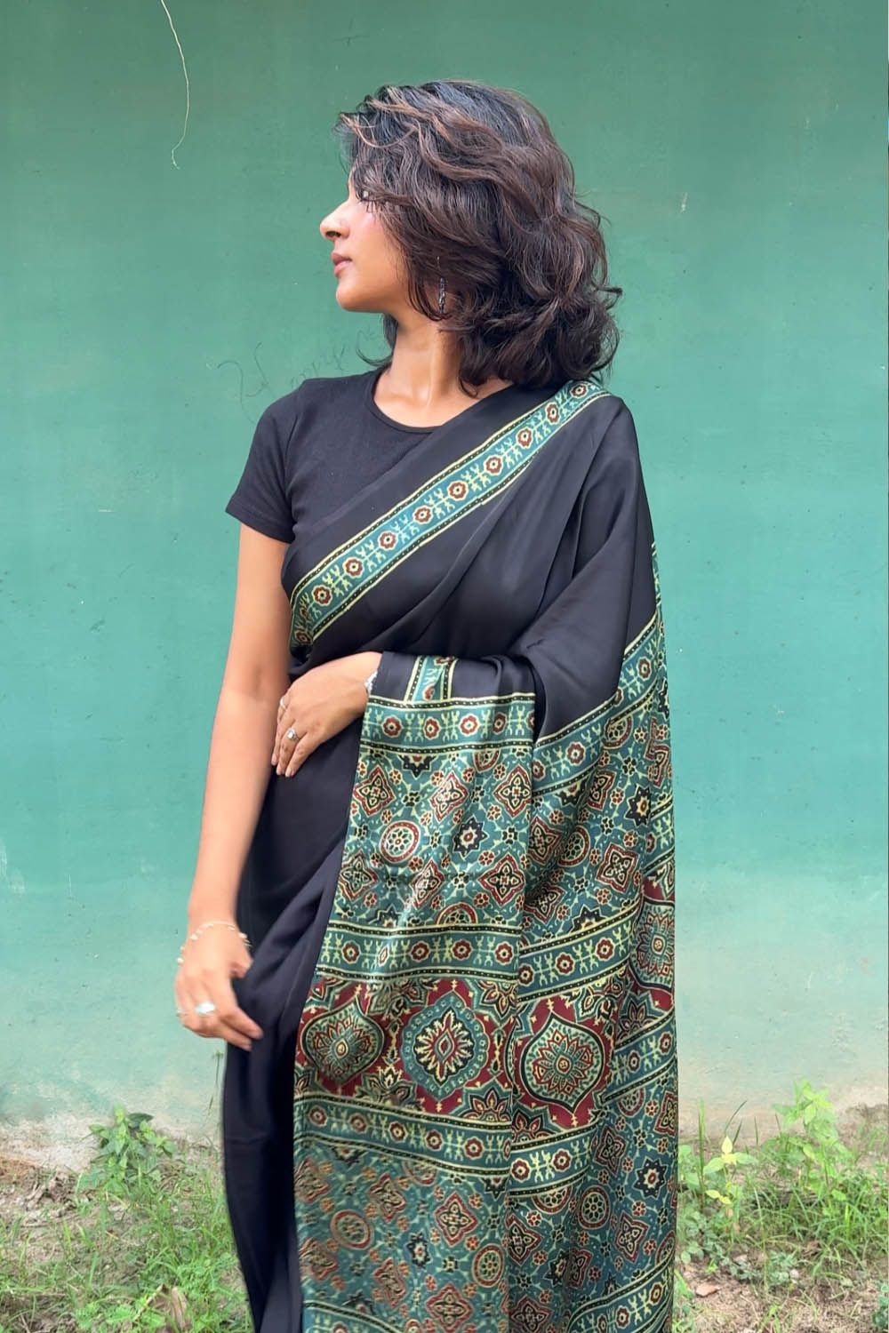 Modal silk Plain Black Body and green Ajrkh Printed Saree