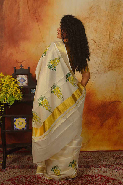 Kerala Golden Tissue Saree with Golden Shower Floral Print