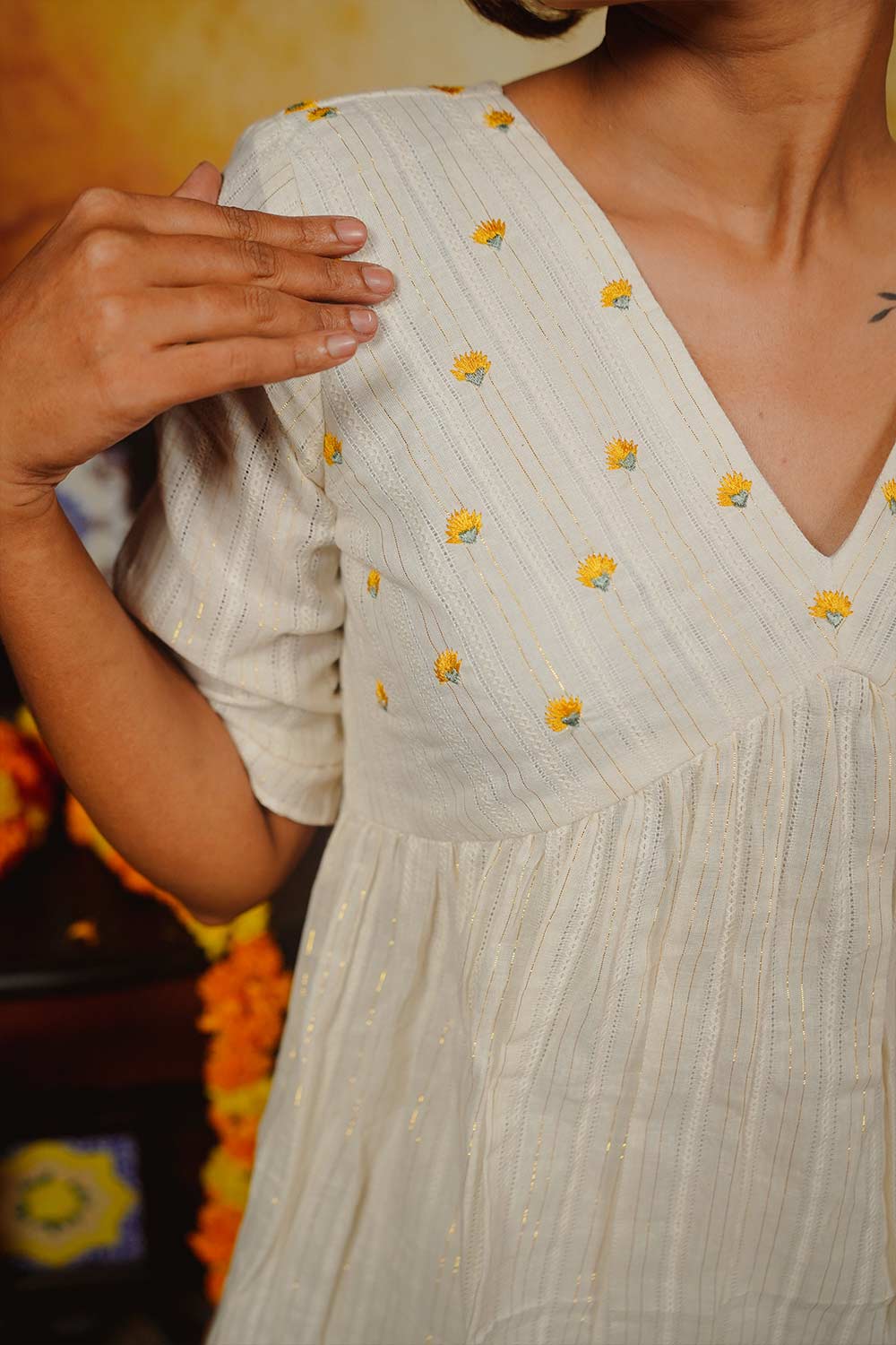 Off-White Peplum Top with Yellow Floral Embroidery